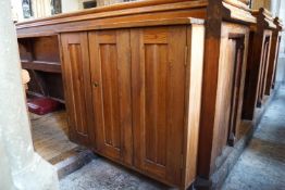 A Victorian pine pew with triple paneled back and prayer book shelf to the reverse (drilled hole)