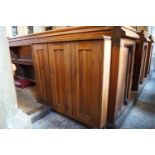 A Victorian pine pew with triple paneled back and prayer book shelf to the reverse (drilled hole)