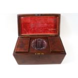 A George III mahogany tea caddy with brass handle,