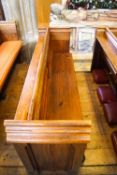 A Victorian pine pew with doubled paneled back and prayer book shelf to the reverse, 83cm high,