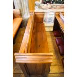 A Victorian pine pew with doubled paneled back and prayer book shelf to the reverse, 83cm high,