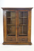 A 19th century walnut large glazed two door book/display cabinet ,