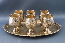 Six Indian white metal tot cups,