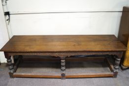 A large oak rectory table with four plank top on six turned legs linked by stretchers 82cm high,