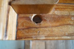 A Victorian pine pew with triple paneled back and prayer book shelf to the reverse (drilled hole)