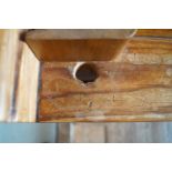 A Victorian pine pew with triple paneled back and prayer book shelf to the reverse (drilled hole)