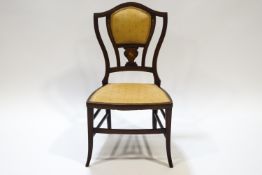 An Edwardian mahogany and marquetry saloon chair with boxwood stringing