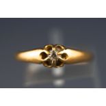 A Victorian yellow metal single stone diamond ring.