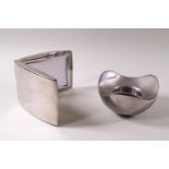 A Georg Jensen tea light holder and a Mont Blanc frame,