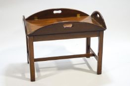 A mahogany period style butlers tray table, on a stand,