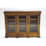 An early Victorian walnut three door side cabinet,
