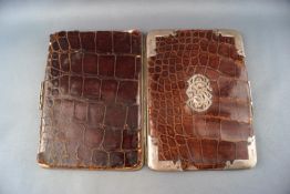 A crocodile skin and base metal wallet with applied silver mounts and monogram London 1898,