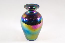 An iridescent finished baluster form glass vase,