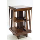A mahogany revolving bookcase of usual form,