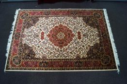 A red ground machine woven Keshan rug,