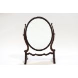 A mahogany framed Georgian style oval dressing mirror,