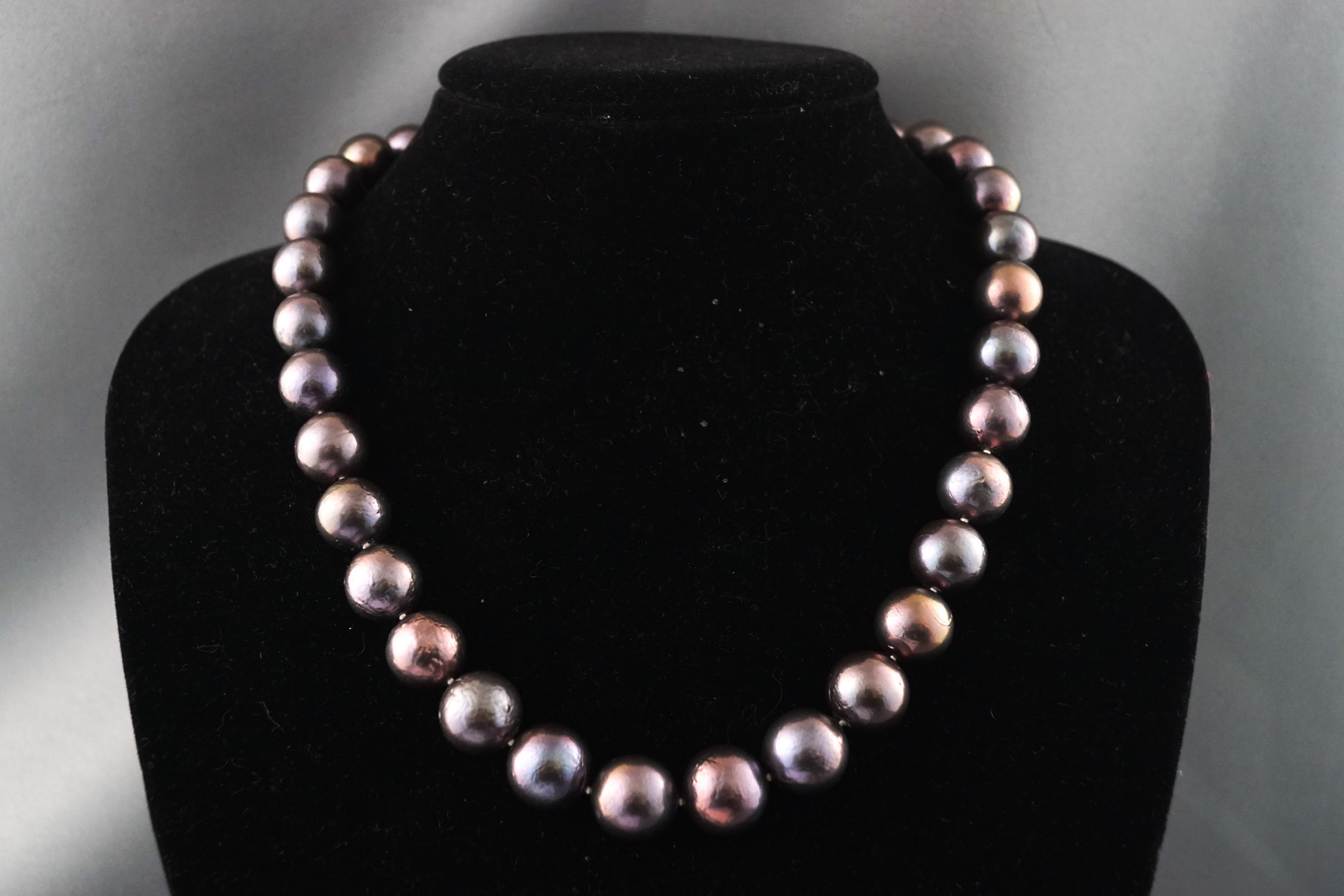 A single strand of graduated dyed cultured pearls measuring from 11.0mm to 13.0mm.