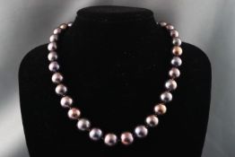 A single strand of graduated dyed cultured pearls measuring from 11.0mm to 13.0mm.