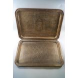 Two Indian brass rectangular trays, with engraved decoration,