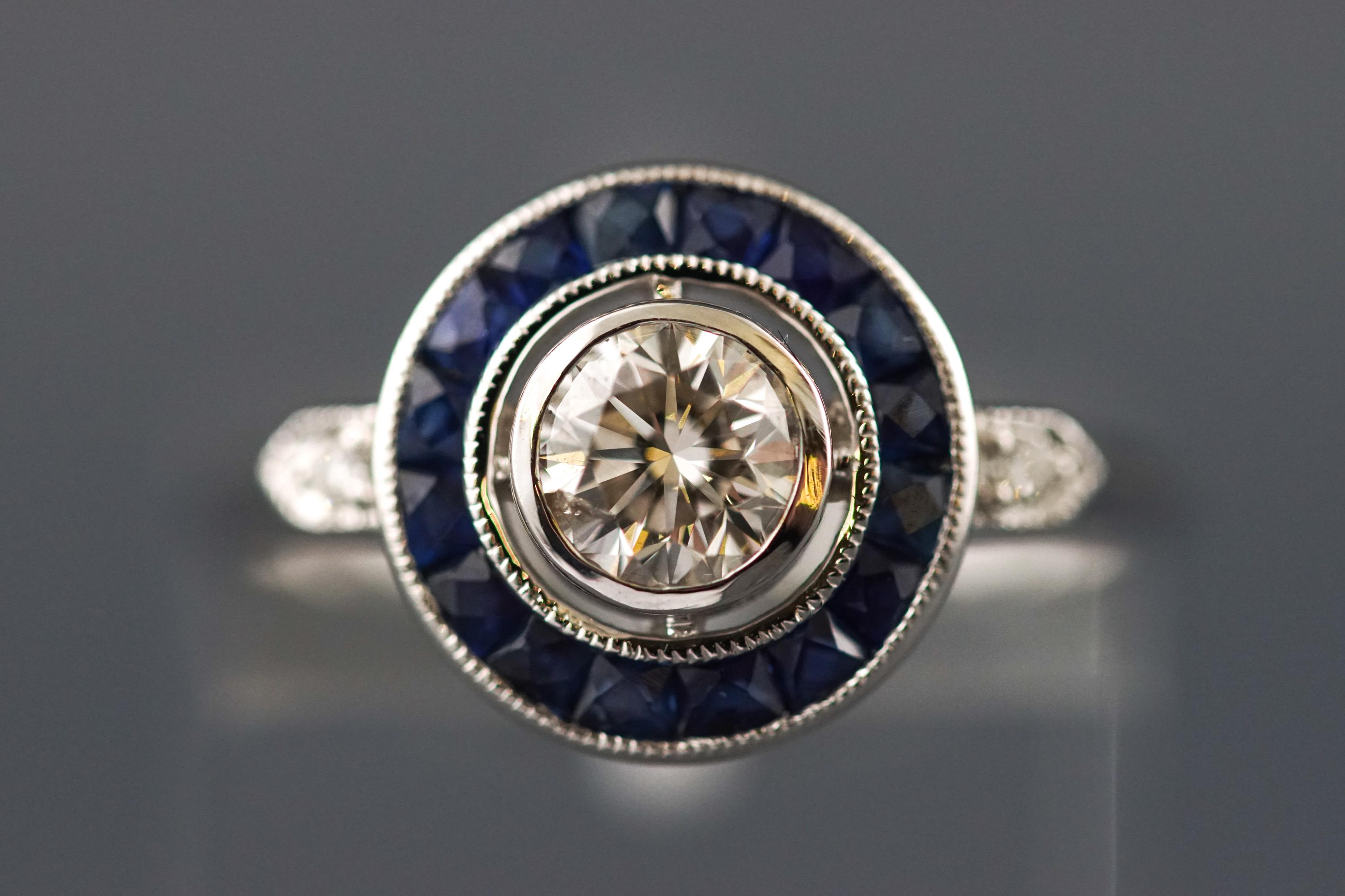 A modern white metal dress ring set with a round brilliant cut diamond of approximately 0.53 carats.