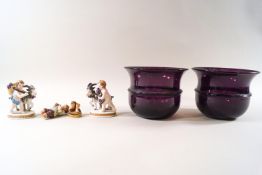 A pair of ribbed amethyst glass bowls,