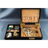 A black jewellery case, with removable tray containing a selection of assorted costume jewellery etc