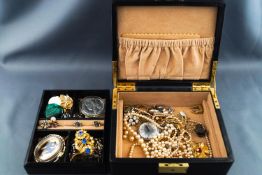 A black jewellery case, with removable tray containing a selection of assorted costume jewellery etc