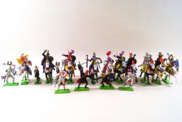 A bag of Britains die cast base toys,