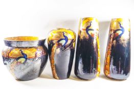 A garniture of four Phoenix ware vases,