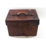 A 19th century leather top hat travelling case with later Dunn & Co bowler hat,