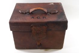 A 19th century leather top hat travelling case with later Dunn & Co bowler hat,