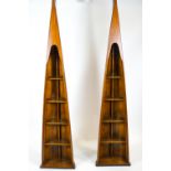 A pair of shaped wooden bookcases in the form of skiff prows, each set with five shelves,