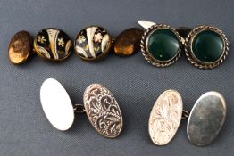 A collection of three pairs of cufflinks consisting of an oval engraved chain link pair,