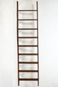 A set of plain form pine library steps with treads,