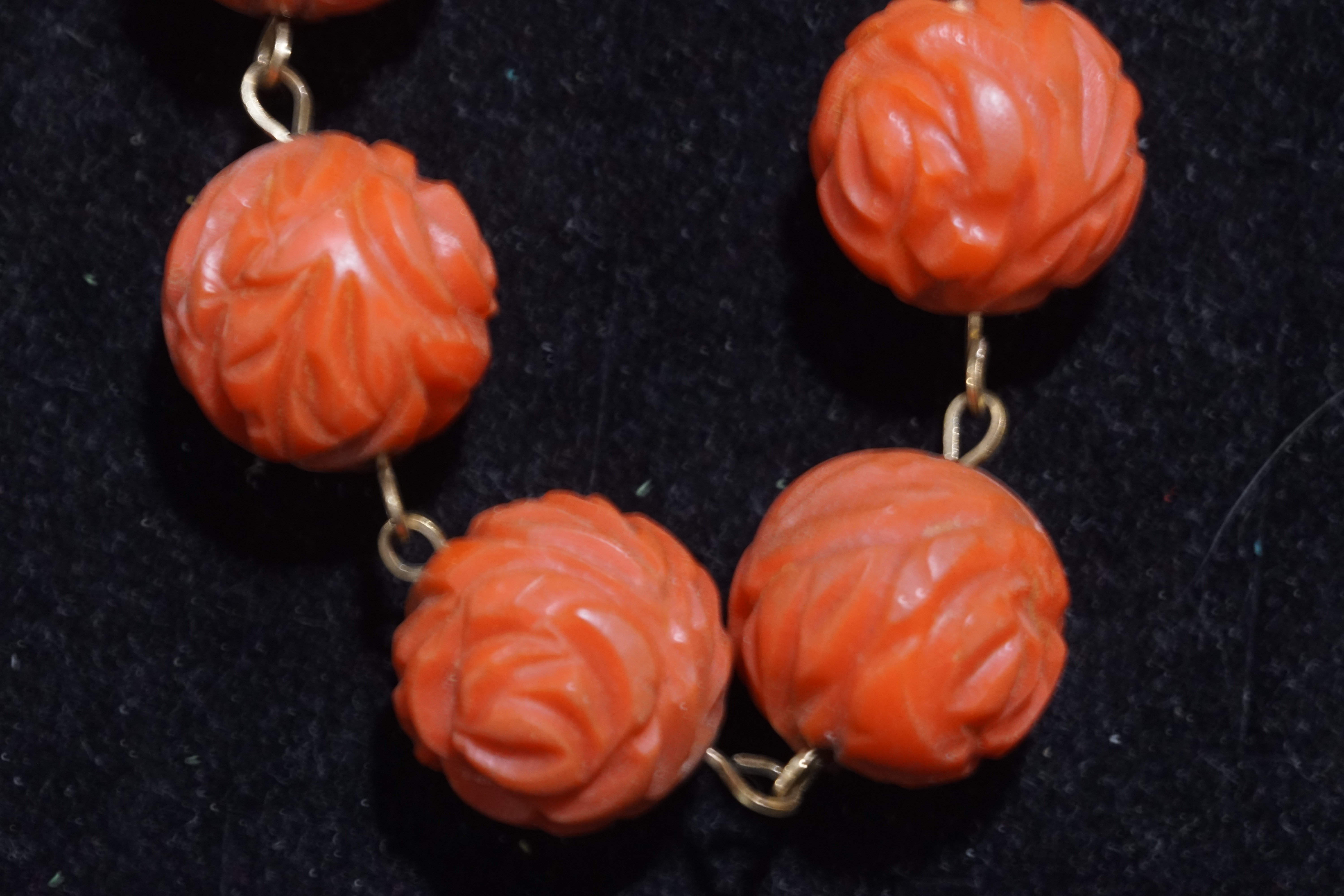 A collection of coral necklaces to include a large carved beaded necklace, - Image 2 of 5