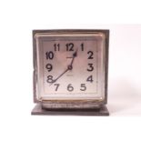 A pewter cased Liberty & Co Tudric clock of squared form with a spot hammered finish,