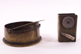 WWI brass trench art : A shell end ashtray crafted in the form of a peaked cap, 9cm diameter,