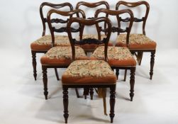 A set of six Victorian rosewood balloon back dining chairs