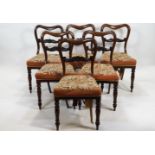 A set of six Victorian rosewood balloon back dining chairs