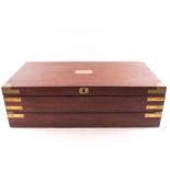 A mahogany and brass bound three fold campaign writing slope with fitted interior