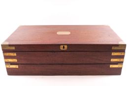 A mahogany and brass bound three fold campaign writing slope with fitted interior