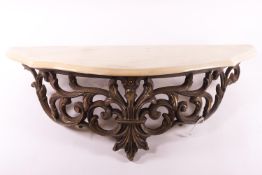 A composite wall console bracket with a shaped cream stone top