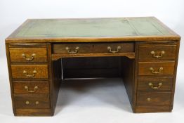 An oak twin pedestal desk in the art deco style