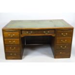 An oak twin pedestal desk in the art deco style