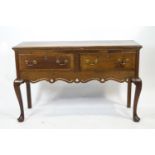 An oak dresser base of early 18th century provincial form,