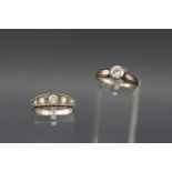 A collection of two white metal dress rings each set with colourless cubic zirconia.