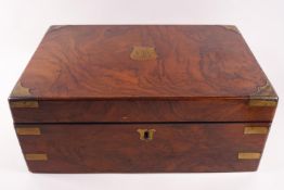 A 19th century walnut and brass bound writing slope with secret drawer section,