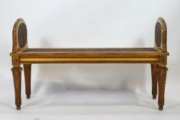 A carved hard wood and gilt 18th century French neo classical style double window seat,