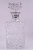 A rectangular cut glass decanter and stopper, with silver collar, by Garrard & Co,