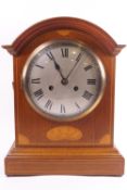 A late Georgian style mahogany striking bracket clock with inlaid decoration,